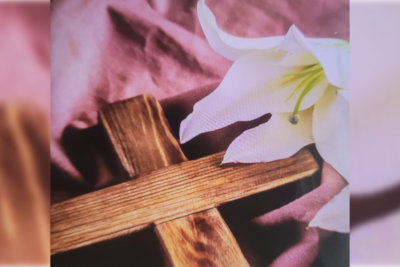 orchid and cross on a sheet